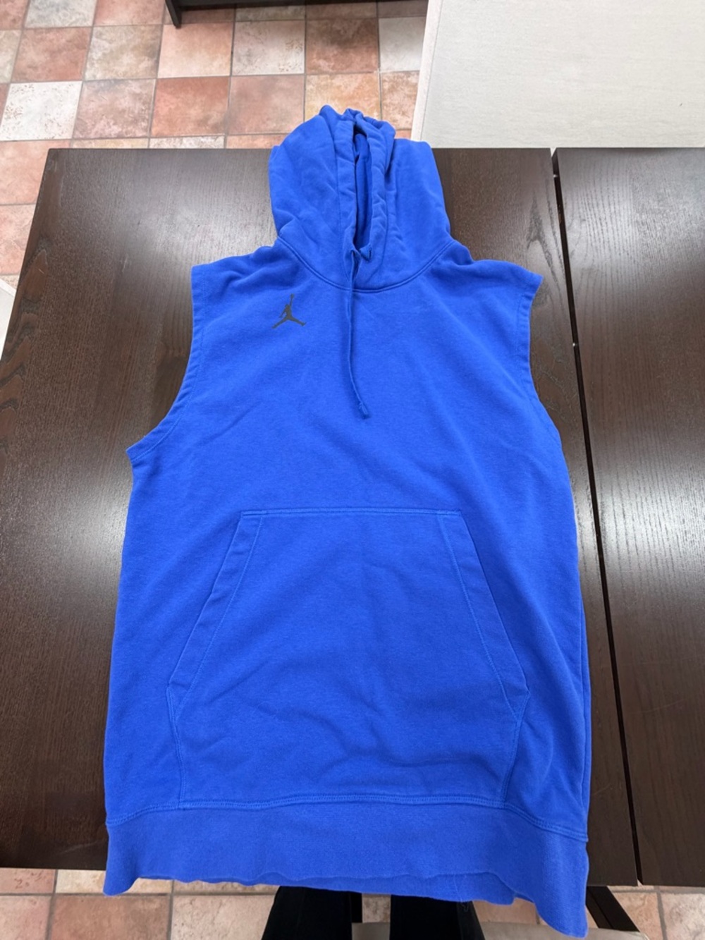 One small Nike hooded sleeve-less sweatshirt